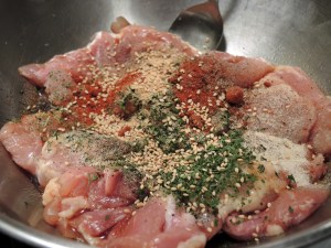 Spices Mixed into Raw Chicken Thights