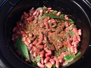 Red Beans with spices onions and green peppers in the slow cooker