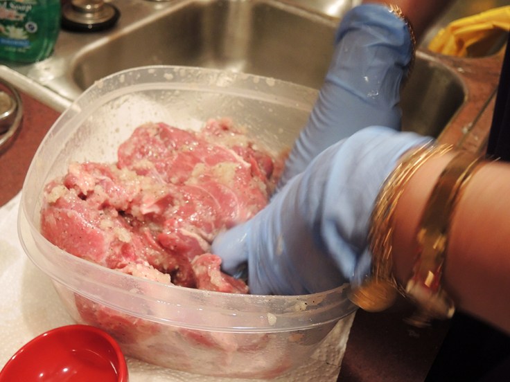 Mixing Lamb with Middle Eastern Marinade