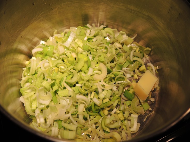 Sauteeing Diced Leeks in Butter for Man Fuel's Potato Leek Soup