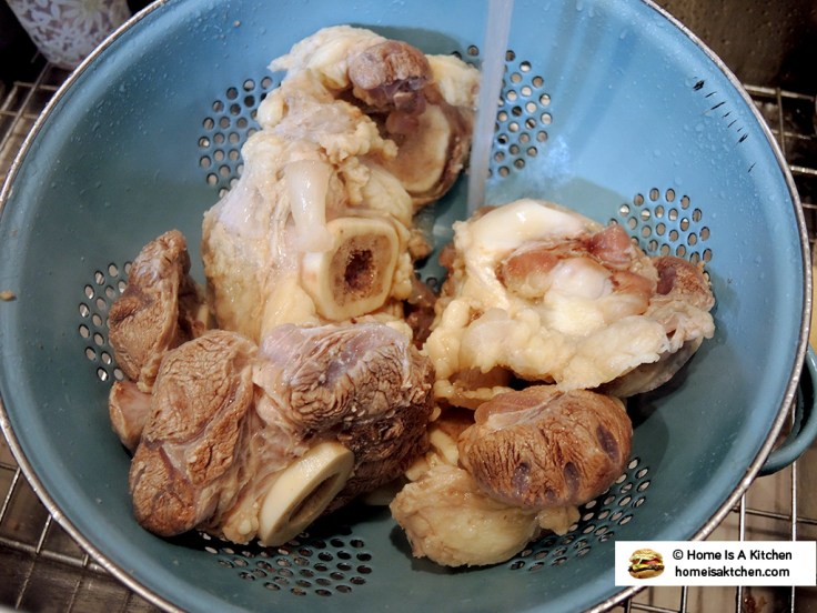 Home Is A Kitchen - Draining Beef Bones for Pho
